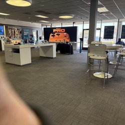AT&T Store - Seems to have four workers, but the wait is long.  There are 9 parties waiting.  Bring a book...