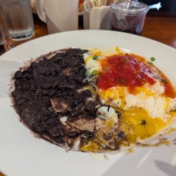 Huevos rancheros minutes sour cream and cheese. I already started eating before photo. Lol Huevos rancheros minutes sour cream and cheese. I already started eating before photo. Lol