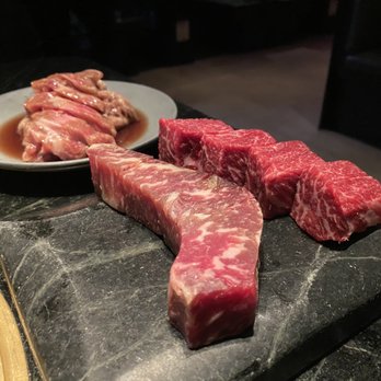 COTE Miami - 110 day aged steak(bottom left), Cote steak(bottom right), galbi(top) - Korean Near Me - Miami, Florida COTE Miami - 110 day aged steak(bottom left), Cote steak(bottom right), galbi(top) - Korean Near Me - Miami, Florida