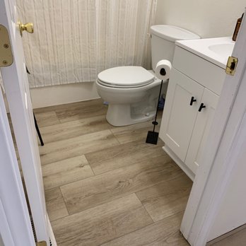 Potter & Son's Floor Store - a bathroom with a toilet and shower - Flooring Near Me - St. George, Utah Potter & Son's Floor Store - a bathroom with a toilet and shower - Flooring Near Me - St. George, Utah