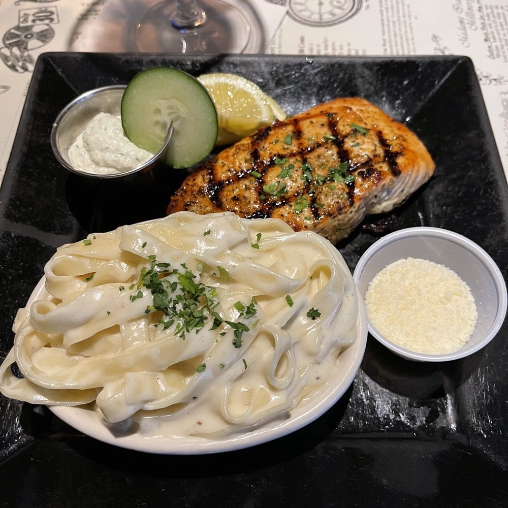 Chicago Speakeasy - Atlantic Salmon with Fettuccine Alfredo was so delicious!! - New American Near Me - Des Moines, Iowa