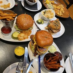 730 Tavern, Kitchen & Patio - 730 Burger with fries, Barbecue Burger with sweet potato fries, and Pesto Chicken Sandwich Burger