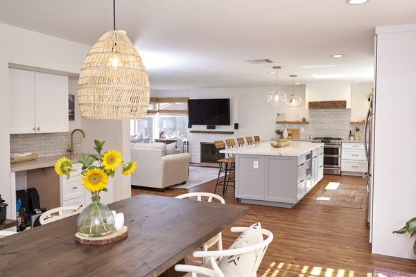 Open Kitchen Concept - This older home was in need of some small kitchen ideas, so the we created a larger space with an open concept kitchen by gutting the first floor and knocking down a couple of walls. The open concept allows a great alternative to putting chairs around an island when space is limited. Now the homeowner can seamlessly chat with guests while working in the kitchen. The change gives a more welcoming layout.