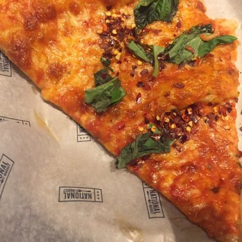 Zizi's Pizza - Excuse my immediate taste test, but this is the Margarita Basil slice - Specialty Food Near Me