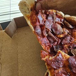 Domino's Pizza - How thin it is. Cardboard  thin