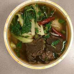 Beef brisket with Shanghai noodles w/ boiled egg in a spicy broth Beef brisket with Shanghai noodles w/ boiled egg in a spicy broth