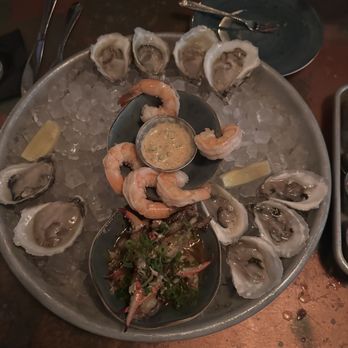 St. Roch Fine Oysters + Bar - This is the 18 oyster platter with blue crab and shrimp... after we had already dug in. Yum! - New American Near Me - Raleigh, North Carolina St. Roch Fine Oysters + Bar - This is the 18 oyster platter with blue crab and shrimp... after we had already dug in. Yum! - New American Near Me - Raleigh, North Carolina