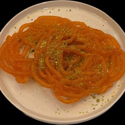 Jalebi : Coil shaped donut, soaked in simple sugar syrup. Jalebi : Coil shaped donut, soaked in simple sugar syrup.