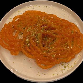 Food Street - Jalebi : Coil shaped donut, soaked in simple sugar syrup. - Pakistani Near Me - Secaucus, New Jersey Food Street - Jalebi : Coil shaped donut, soaked in simple sugar syrup. - Pakistani Near Me - Secaucus, New Jersey