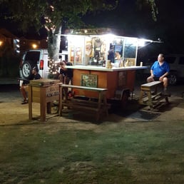 man sitting at a picnic table man sitting at a picnic table