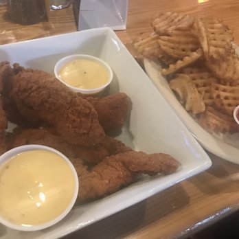 Anderson Pub and Grill - Chicken tenders with honey mustard & waffle fries. - Sports Bars Near Me - Cincinnati, Ohio Anderson Pub and Grill - Chicken tenders with honey mustard & waffle fries. - Sports Bars Near Me - Cincinnati, Ohio