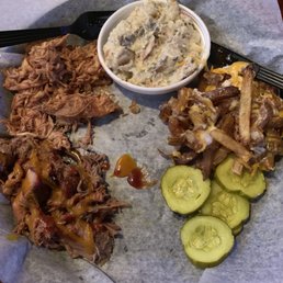 Pulled chicken and pork with potato salad and loaded fries Pulled chicken and pork with potato salad and loaded fries