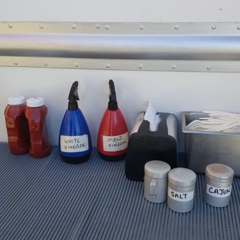 Jiggers Fish & Chips - Condiments! The malt vinegar was stream, not spray. - Food Trucks Near Me - Ucluelet, British Columbia