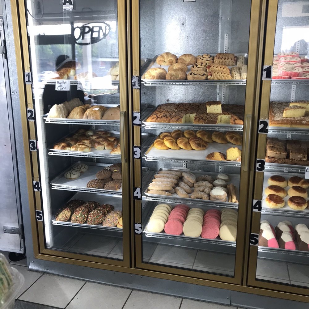 a display case full of donuts a display case full of donuts