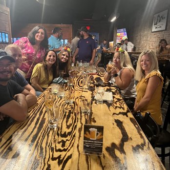 Old Towne Beer Hall & Growler - a group of people sitting at a table - Bars Near Me - Franklin, Indiana