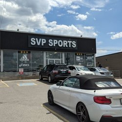 SVP Sports - Cartwright - From the parking lot right on the driveway from the street looking at the storefront and part of the front parking lot area. July 2022