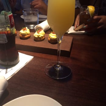 Nick's On 2nd - Bacon deviled eggs & pineapple mimosa. - New American Near Me - Long Beach, California