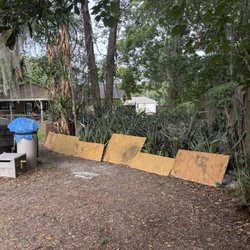 Fair Rate Landscape & Cleaning solution - This is the 120 sq ft triangular area in backyard with Spanish Bayonets to be removed and hauled off. Boards are there to protect blind dog.