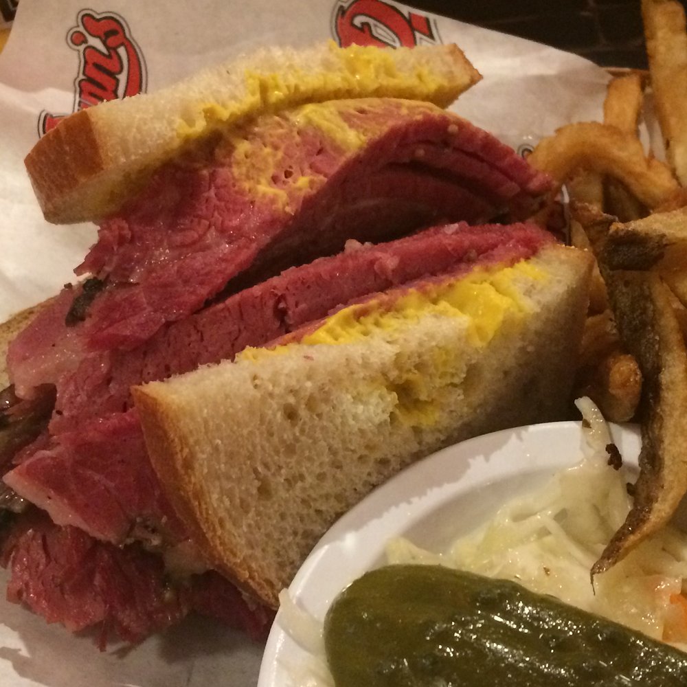 Dunn's - Closeup of smoked meat sandwich - Poutineries Near Me - Montreal, Quebec