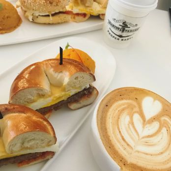 Proper Bagel - Gouda, egg, sausage on sourdough bagel with Cinnamon honey Latte - Bagels Near Me - Nashville, Tennessee