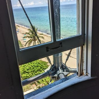 Hillsboro Inlet Lighthouse - A view of the beach from one of the windows - Local Flavor Near Me - Hillsboro Beach, Florida