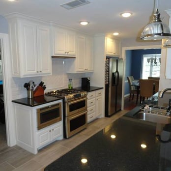 PB General Contractor - a kitchen with white cabinets and black countertops - General Contractors Near Me - Fort Worth, Texas PB General Contractor - a kitchen with white cabinets and black countertops - General Contractors Near Me - Fort Worth, Texas