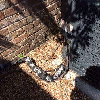 HVAC Heroes - Note wires coming from unit. Should have been encased, tied with electrical tape instead. - Heating & Air Conditioning/HVAC Near Me