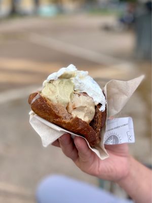 Photo of La Romana - Rome, RM, IT. Brioche w/gelato: chocolate, pistachio, banana and whipped cream - €4