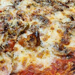 Frank's Pizzeria - Arthur Ave pie well done. Sausage, roasted garlic, hot cherry peppers, spices.