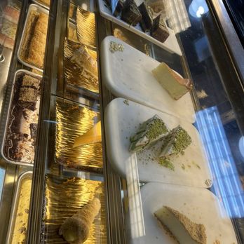 Rumi's Oasis - The dessert display looks old and not clean, and there was a lot of mold and a lot of cakes. - Bakeries Near Me - Elk Grove, California