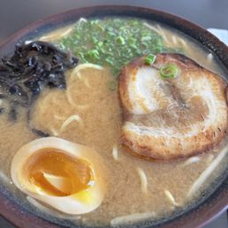 Korean Style Pork Belly / 韩式五花肉 - A bowl of ramen featuring pork belly, soft-boiled egg, chopped green onions, and black fungus in a rich broth.