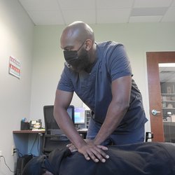 Back Right Mobile Chiropractic - Manual Thoracic adjustment while on lunch break. We can come to your home or office.