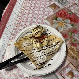 Strawberry crepe with scoop of ice cream Strawberry crepe with scoop of ice cream