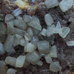 a close up of a donut with ice crystals