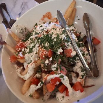Greek Bistro - Shrimp with ouzo flambé and loaded fries with gyro. - Greek Near Me - Glendale, California Greek Bistro - Shrimp with ouzo flambé and loaded fries with gyro. - Greek Near Me - Glendale, California