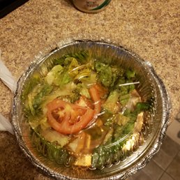 I ordered a shrimp  parmesan dinner which comes with salad and bread this is what I received some wilted lettuce and the shrimp overcooked