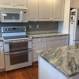 Backsplash still to be finished.  SILVER CLOUD granite
