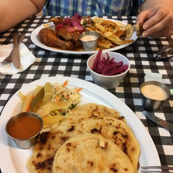 JD Cocina - First plate is Pupusas, handmade tortillas stuffed with cheesy goodness. Second is fried chicken and plantains. - Mexican Near Me - Denham Springs, Louisiana