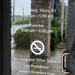 Texas Department of Public Safety - Hours posted on the door.