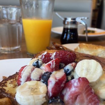 Breakfast Club 51 - This is the fresh squeezed orange juice and I got the Firestone with French toast covered in raspberry, banana, blueberry and strawberry. - Cafes Near Me - Roanoke, Texas