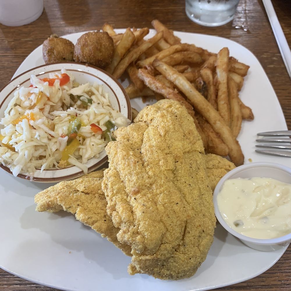 Catfish platter with fries, slaw, and hush puppies. Catfish platter with fries, slaw, and hush puppies.