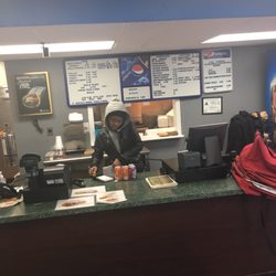 Pizza City & Subs - Inside view of the place and the menu (menu also on the counter and specials as well)