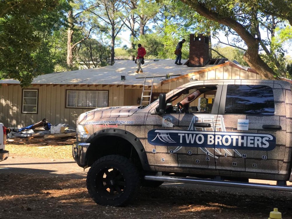 Slide of Two Brothers Roofing