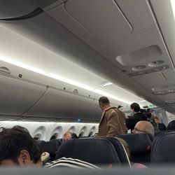 Air France - Enough overhead space for carry-on but I was lied and told there's no space for the whole zone 4 and zone 5