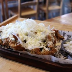 Tok Tok Korean Cuisine - Snowy cheese chicken Deep fried boneless chicken with shredded cheese, thin sliced onions, pickled radish