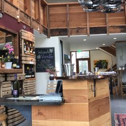 a wine shop with wine bottles on shelves