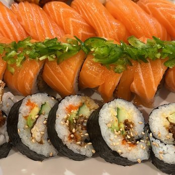 Oishii - Top row L - R: eel, squid, surf clam nigiri 2nd from top: salmon nigiri 3rd row: Rickesh roll  Bottom row: spider roll - Sushi Bars Near Me - Houston, Texas