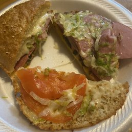 Sandwiches with tomato and very little lettuce. Pitiful looking sandwich Sandwiches with tomato and very little lettuce. Pitiful looking sandwich