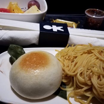 Delta Air Lines - The mid-flight meal was totally vegetarian - plain noodles, with a very good little tub of Szechuan hot sauce. - Airlines Near Me - Orlando, Florida