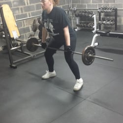 Toned at Home Personal Training - Meredith getting ready to set up for a barbell row in my garage gym.